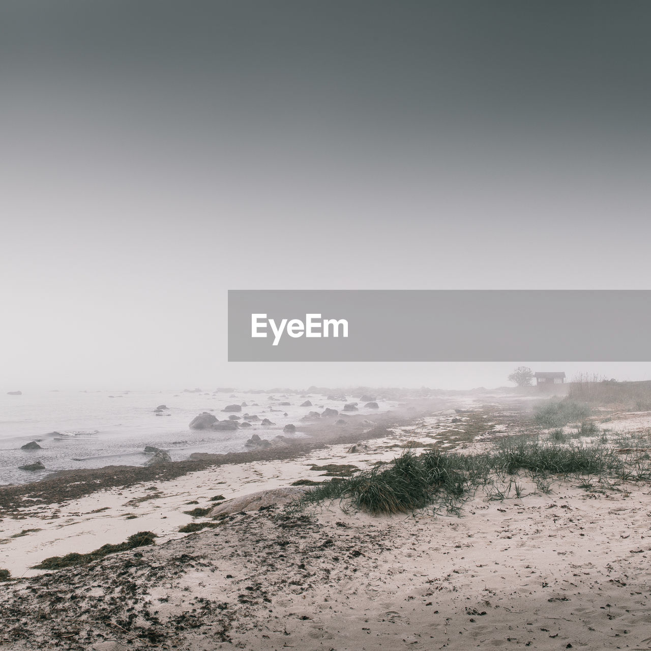 Scenic view of beach against clear sky