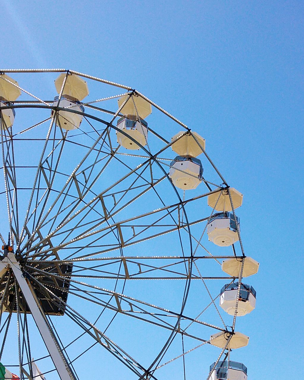 LOW ANGLE VIEW OF FERRIS WHEEL AGAINST SKY