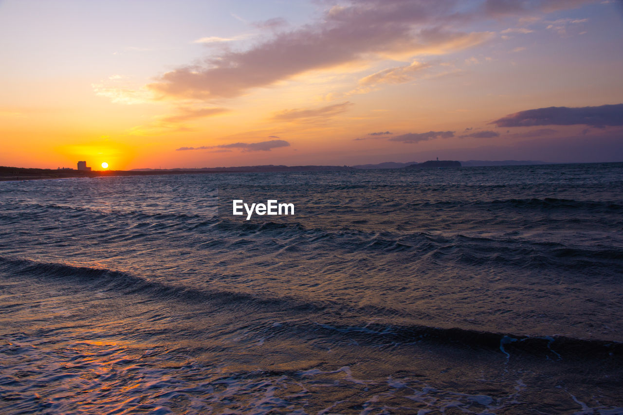 SCENIC VIEW OF SEA DURING SUNSET