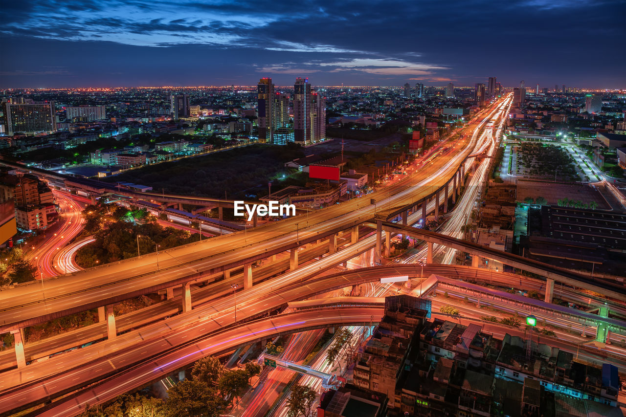 High angle view of city lit up at night