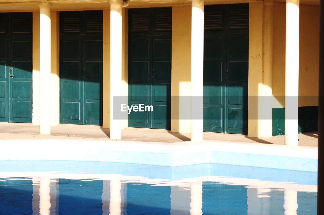 Reflection of doors in swimming pool