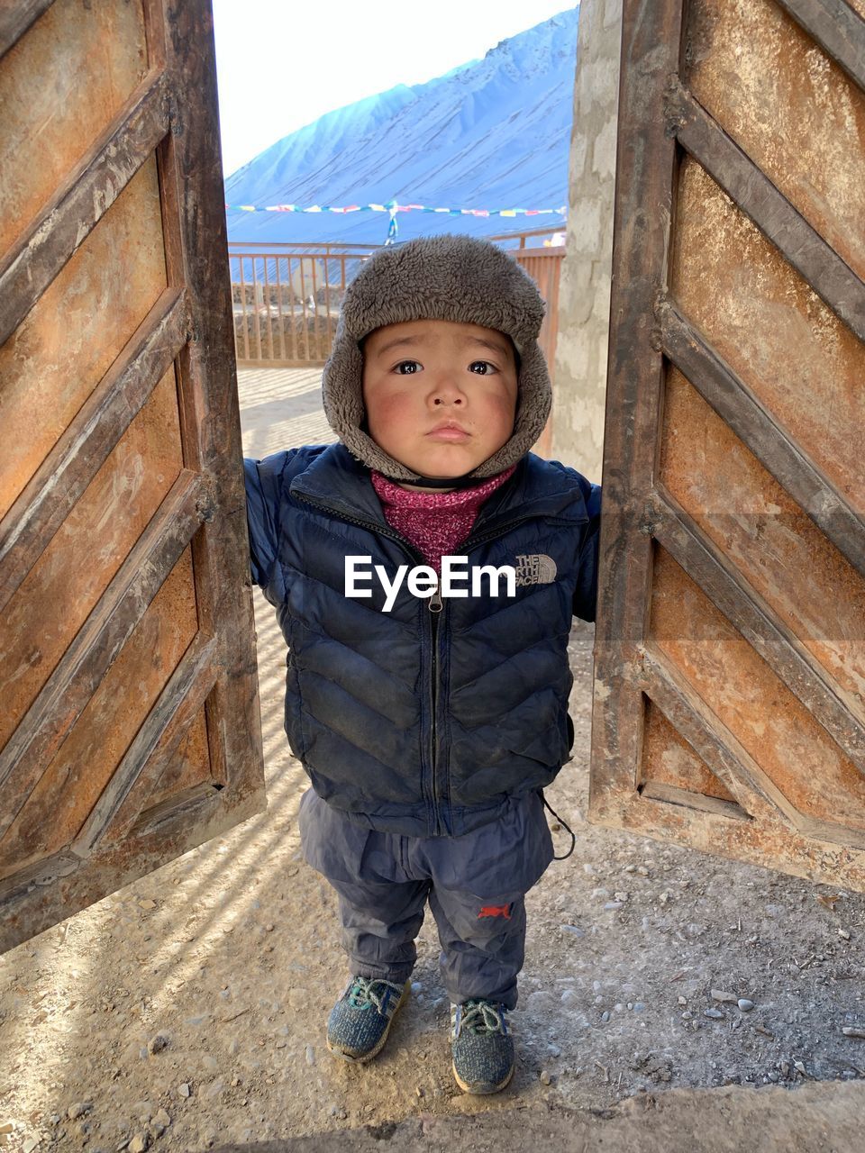 PORTRAIT OF BOY STANDING IN WINTER