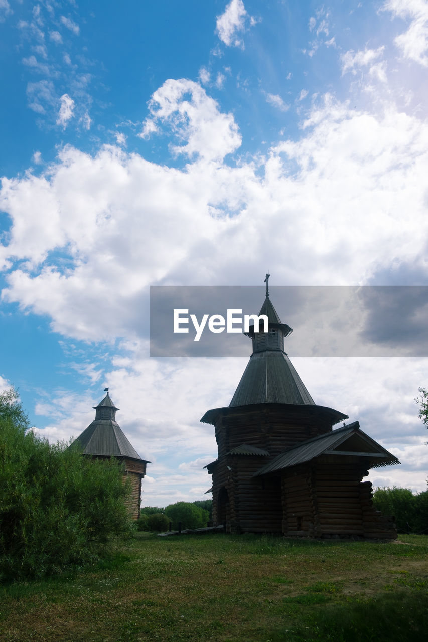 GAZEBO ON FIELD AGAINST SKY