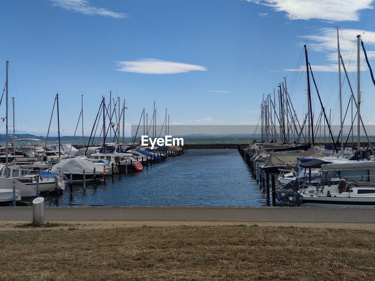 water, nautical vessel, transportation, marina, sailboat, dock, mode of transportation, sky, sea, harbor, mast, moored, pole, nature, cloud, vehicle, boat, ship, no people, coast, bay, sailing, port, travel, beach, pier, travel destinations, watercraft, blue, sailing ship, architecture, day, beauty in nature, vacation, holiday, yacht, outdoors, tranquility, trip, land, scenics - nature, ocean, idyllic, tranquil scene, tall ship, bay of water, sunlight, tourism