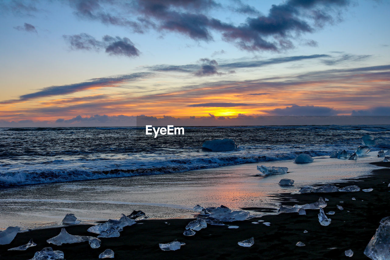 Scenic view of sea against sky during sunset