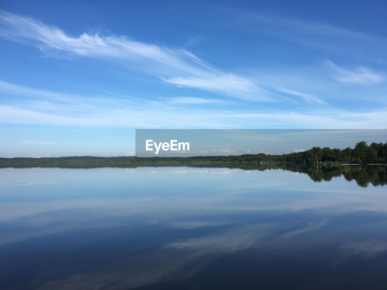 SCENIC VIEW OF REFLECTION OF LAKE AGAINST SKY