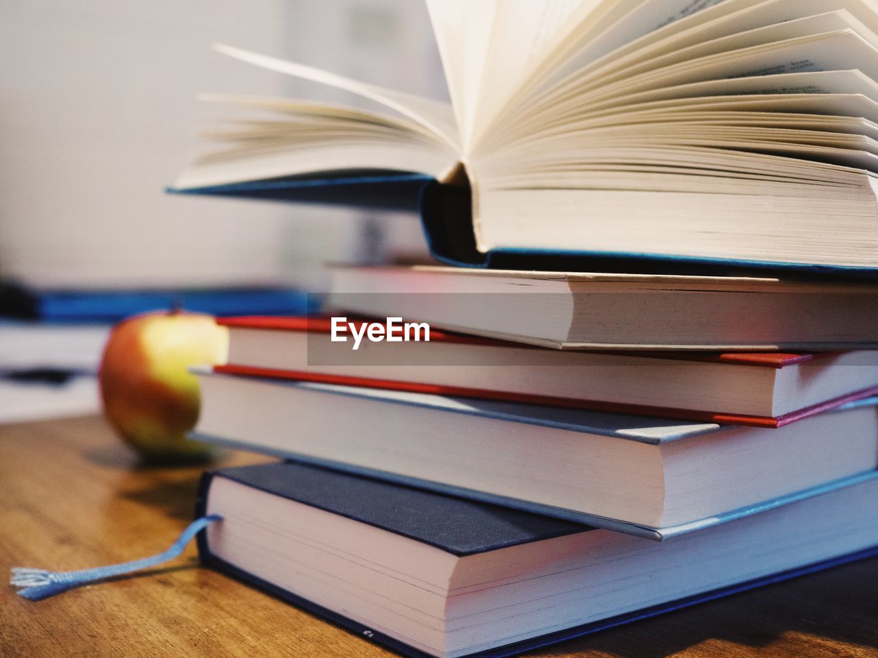 CLOSE-UP OF BOOK ON TABLE