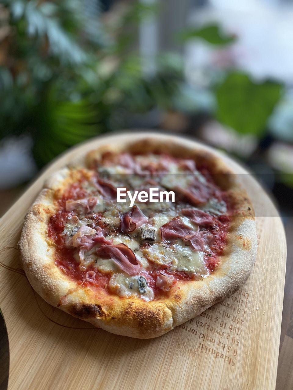 food and drink, food, dish, fast food, pizza, freshness, cuisine, wood, fruit, healthy eating, vegetable, no people, produce, italian food, dairy, plant, baked, cheese, dessert, table, herb, meal, cutting board, close-up, focus on foreground, slice, quiche, indoors