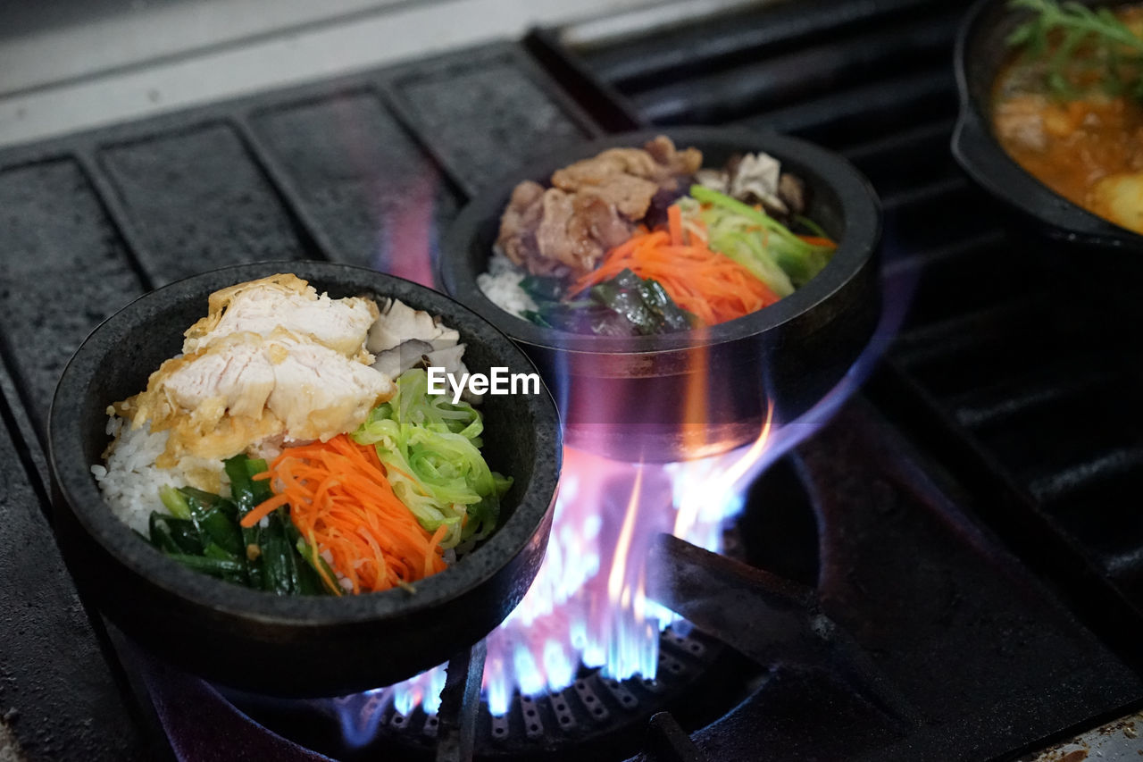 High angle view of fresh food in container on stove