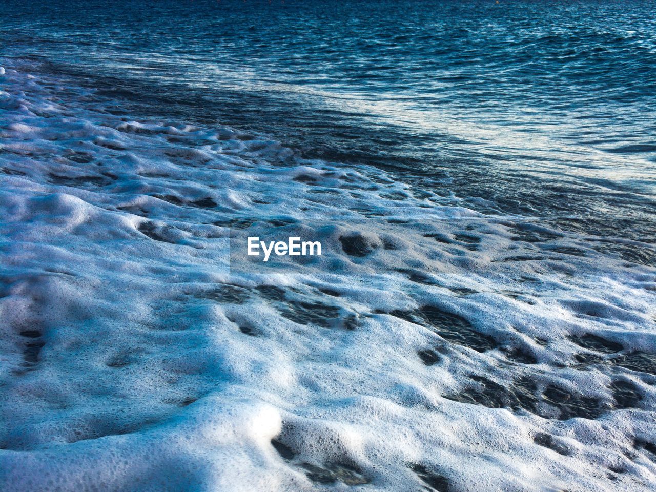 High angle view of waves in sea