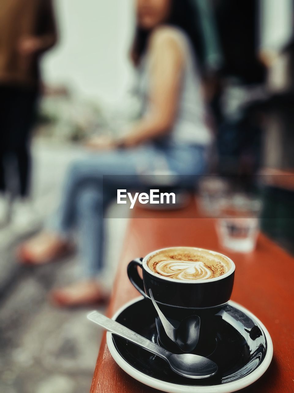 Coffee cup on table at cafe