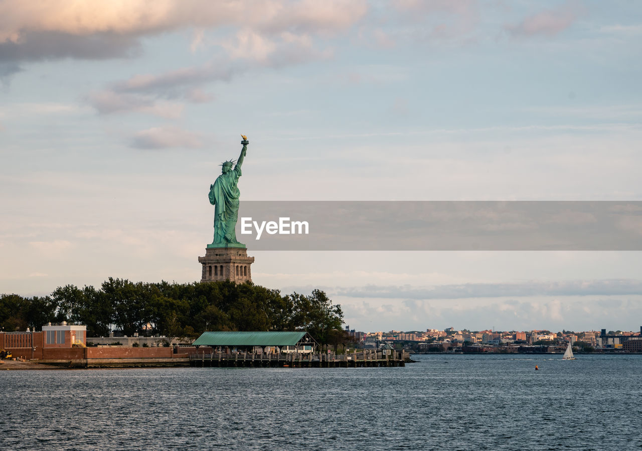 Statue of liberty against cloudy sky