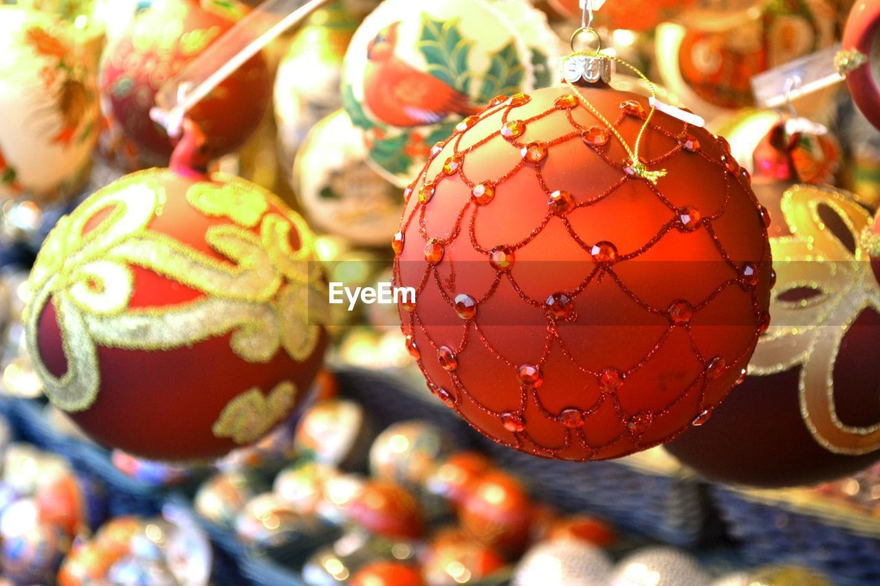 Close-up of christmas ornaments hanging on tree