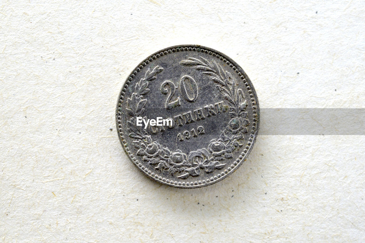 DIRECTLY ABOVE SHOT OF COINS IN CONTAINER