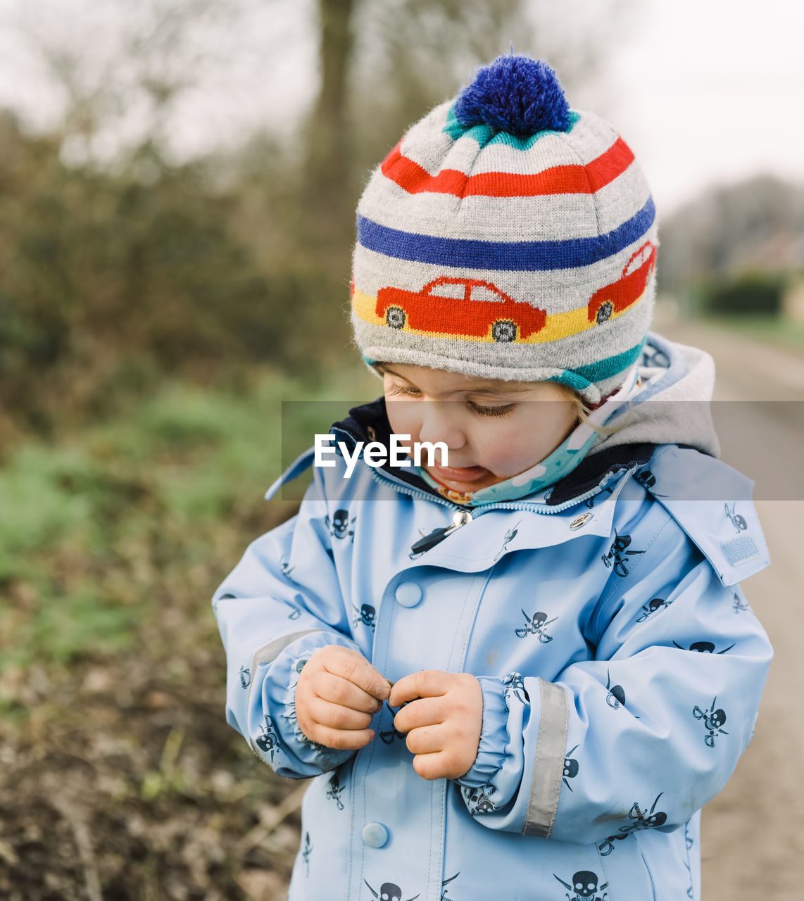 Cute boy standing outdoors