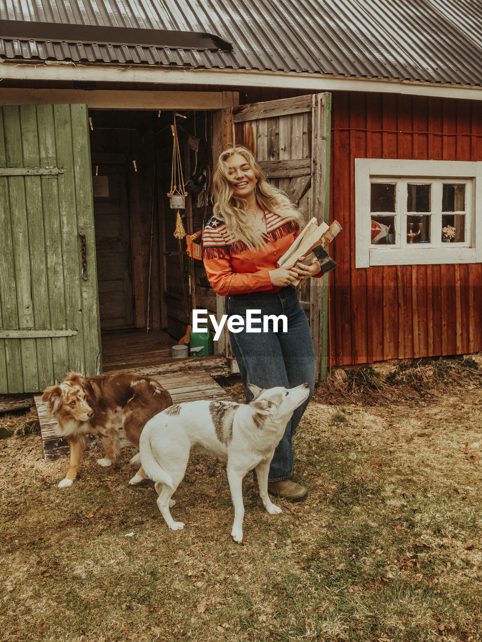 Smiling woman with dogs