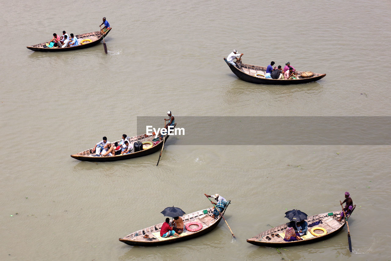 nautical vessel, transportation, mode of transportation, water, group of people, men, high angle view, travel, boat, adult, occupation, gondola, nature, vehicle, tradition, boating, watercraft, women, day, outdoors, river, crowd, travel destinations, lifestyles, group, large group of people, architecture, tourism, person