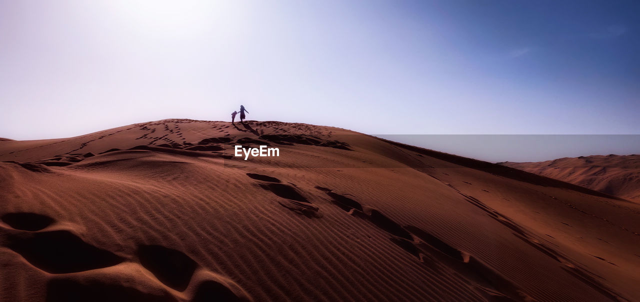 Scenic view of desert against clear sky