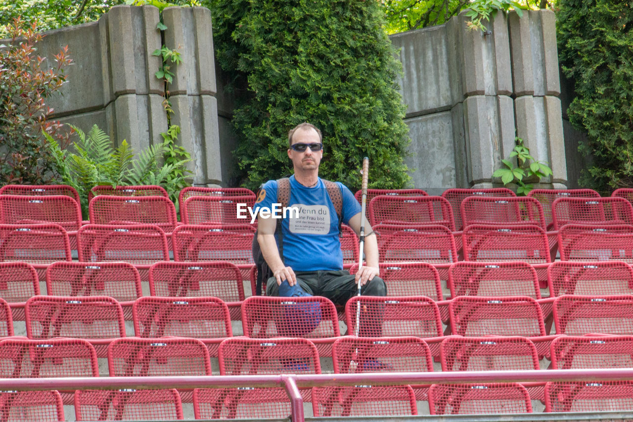 Portrait of man sitting on chair