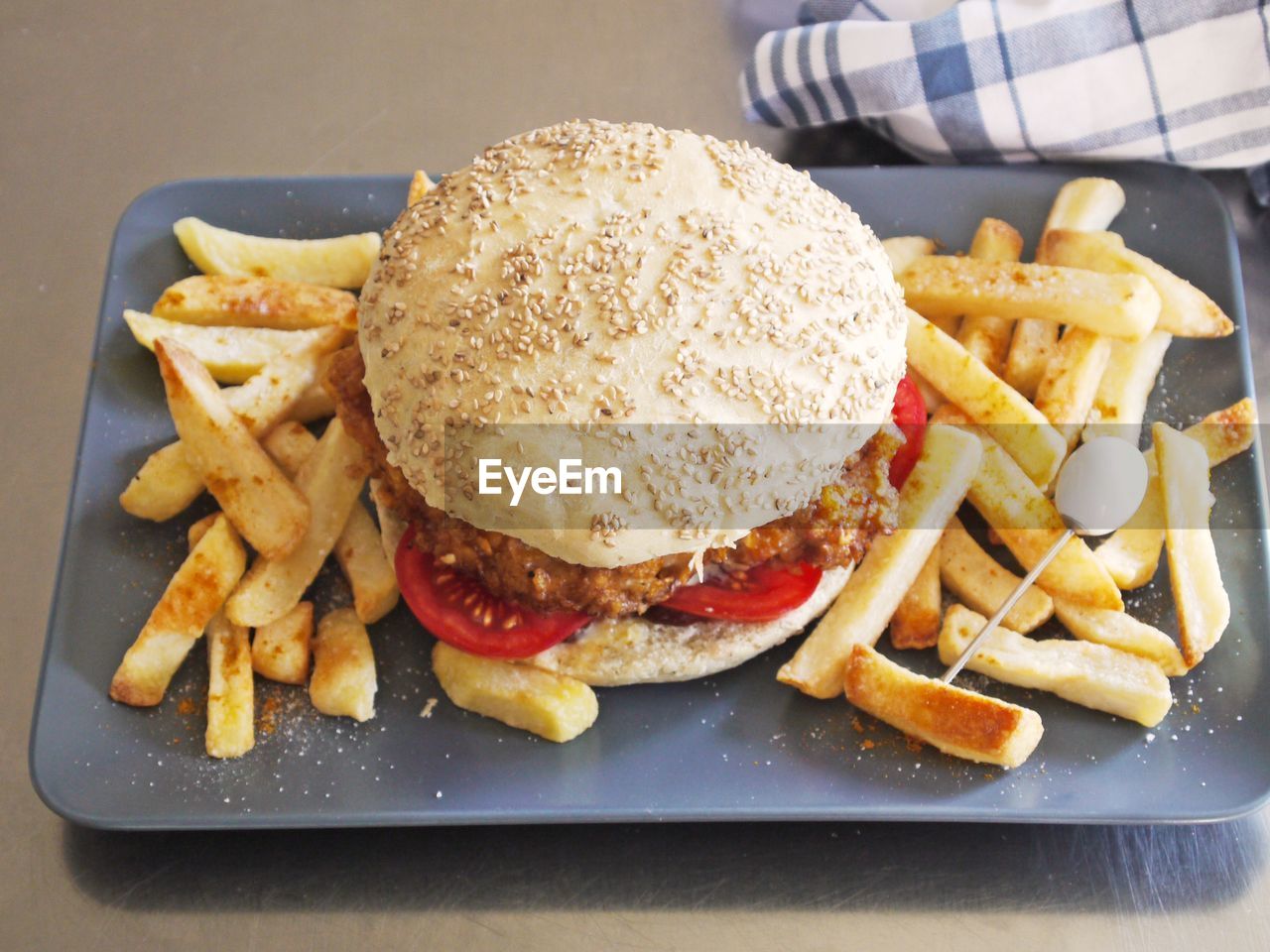 CLOSE-UP OF BURGER WITH MEAT AND FRIES