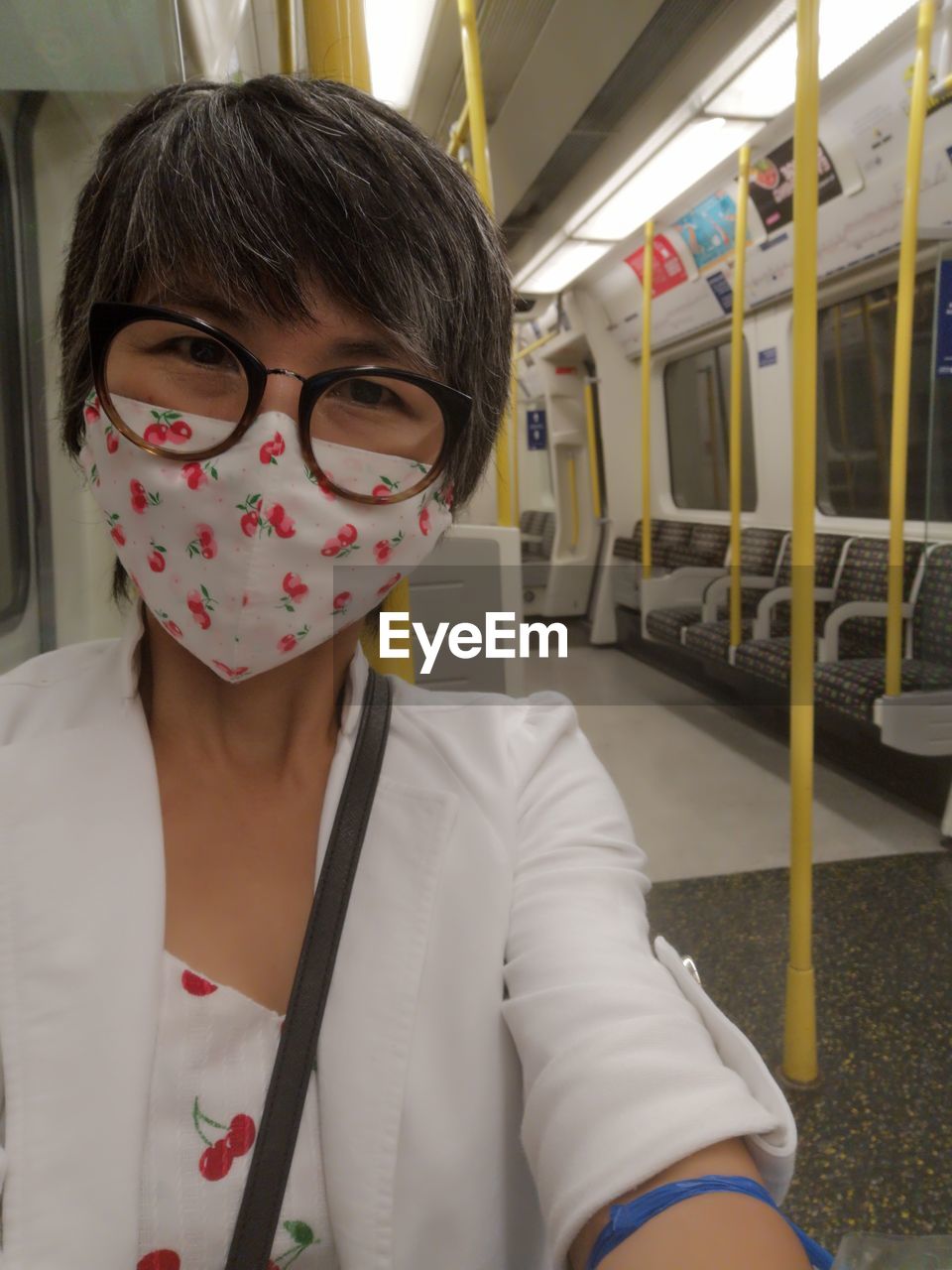 Portrait of woman sitting in train