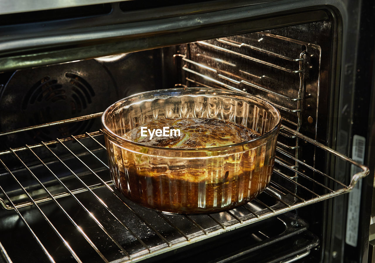 Cauliflower souffle in a transparent bowl in the oven after baking