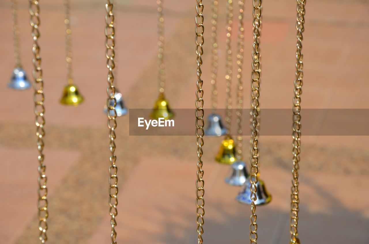 Close-up of small bells hanging