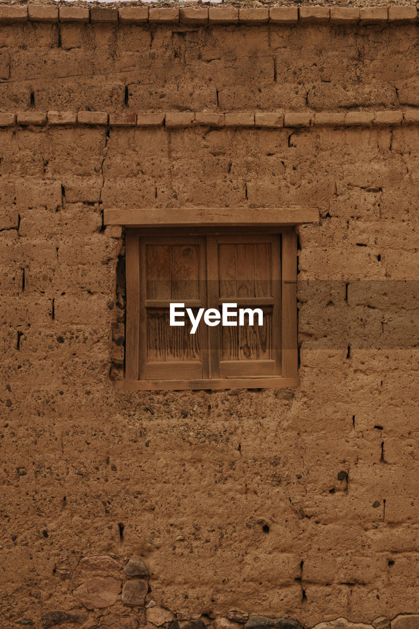 Low angle view of window on old building