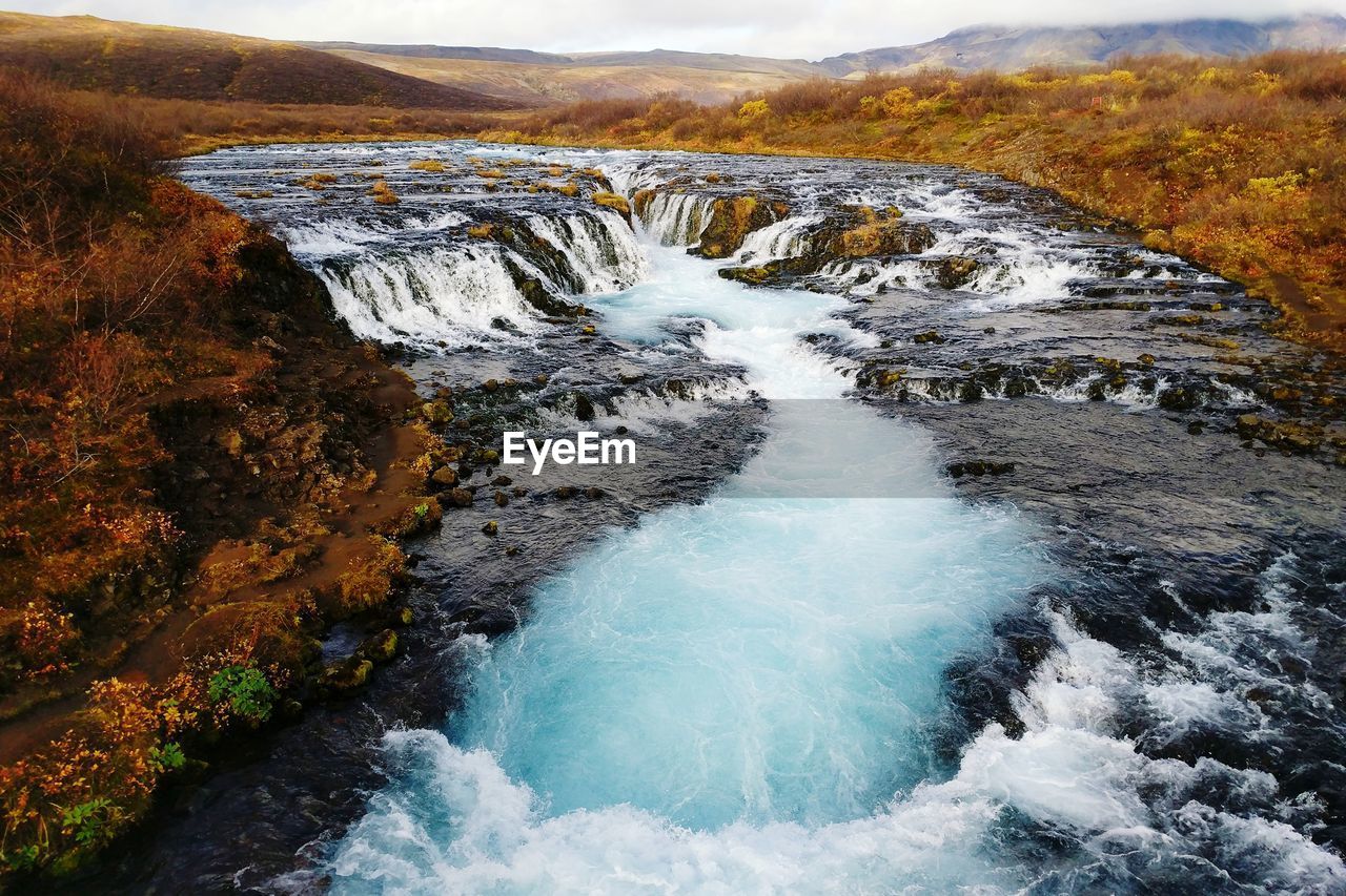 Waterfall in iceland with autumn colors