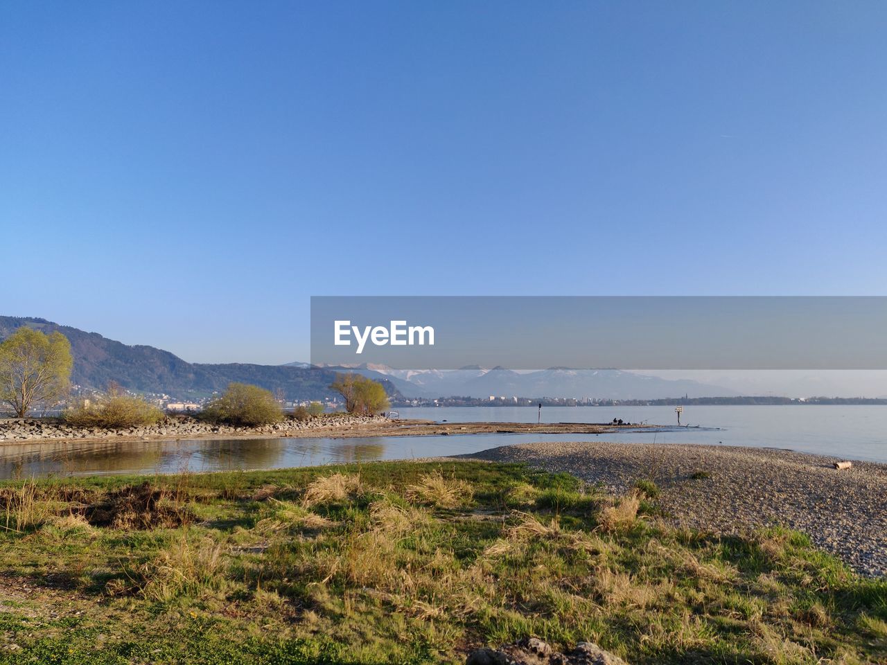 Scenic view of lake constance against clear blue sky