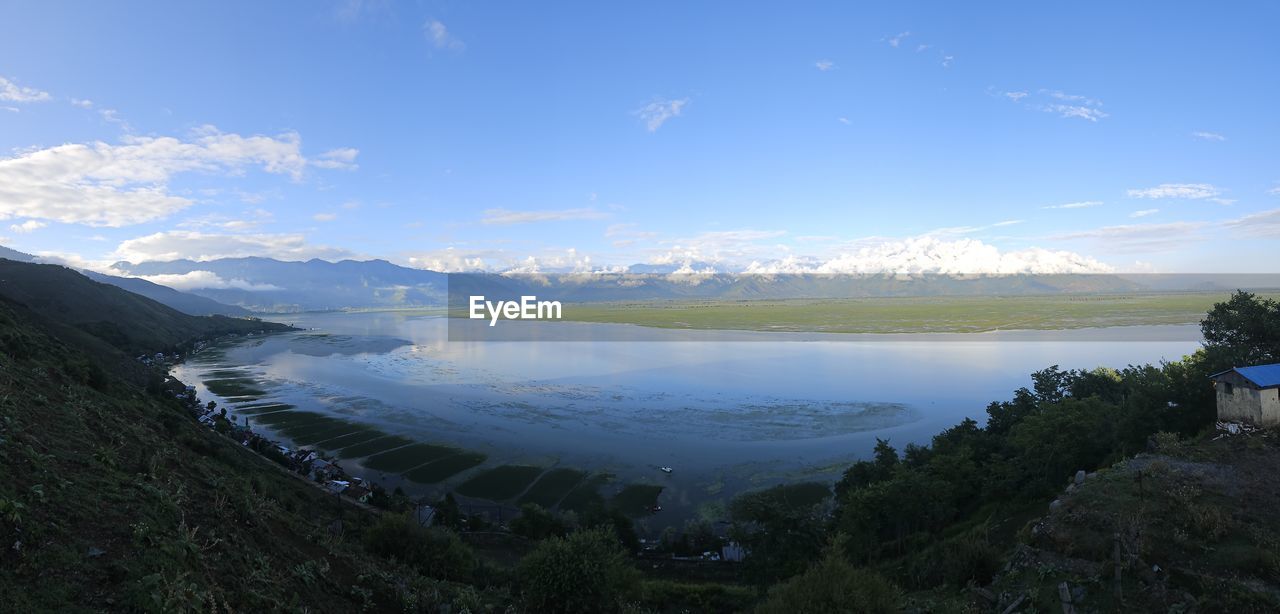 sky, scenics - nature, environment, water, mountain, beauty in nature, landscape, nature, mountain range, lake, cloud, reservoir, land, travel, plant, blue, travel destinations, tranquility, tranquil scene, tree, no people, tourism, outdoors, highland, body of water, forest, day, non-urban scene, vacation, beach, trip, holiday, idyllic, summer, reflection