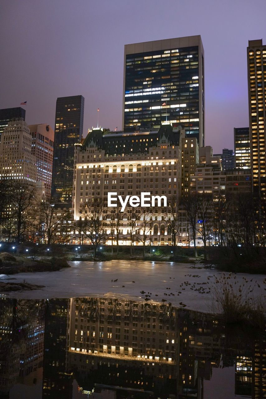 Illuminated buildings in city at night