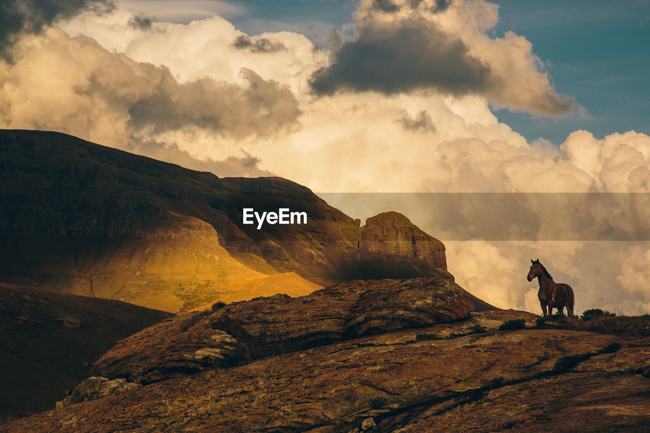 Scenic view of mountains against sky during sunset