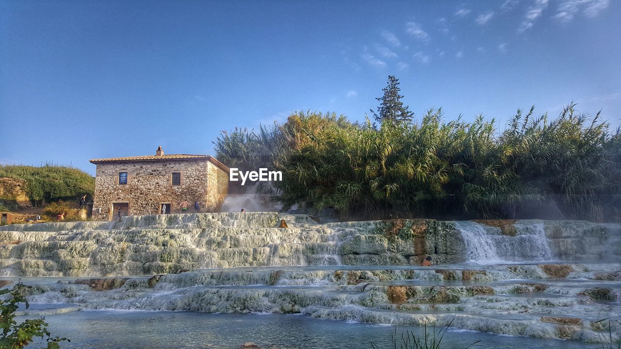 SCENIC VIEW OF LAKE AGAINST BUILDINGS