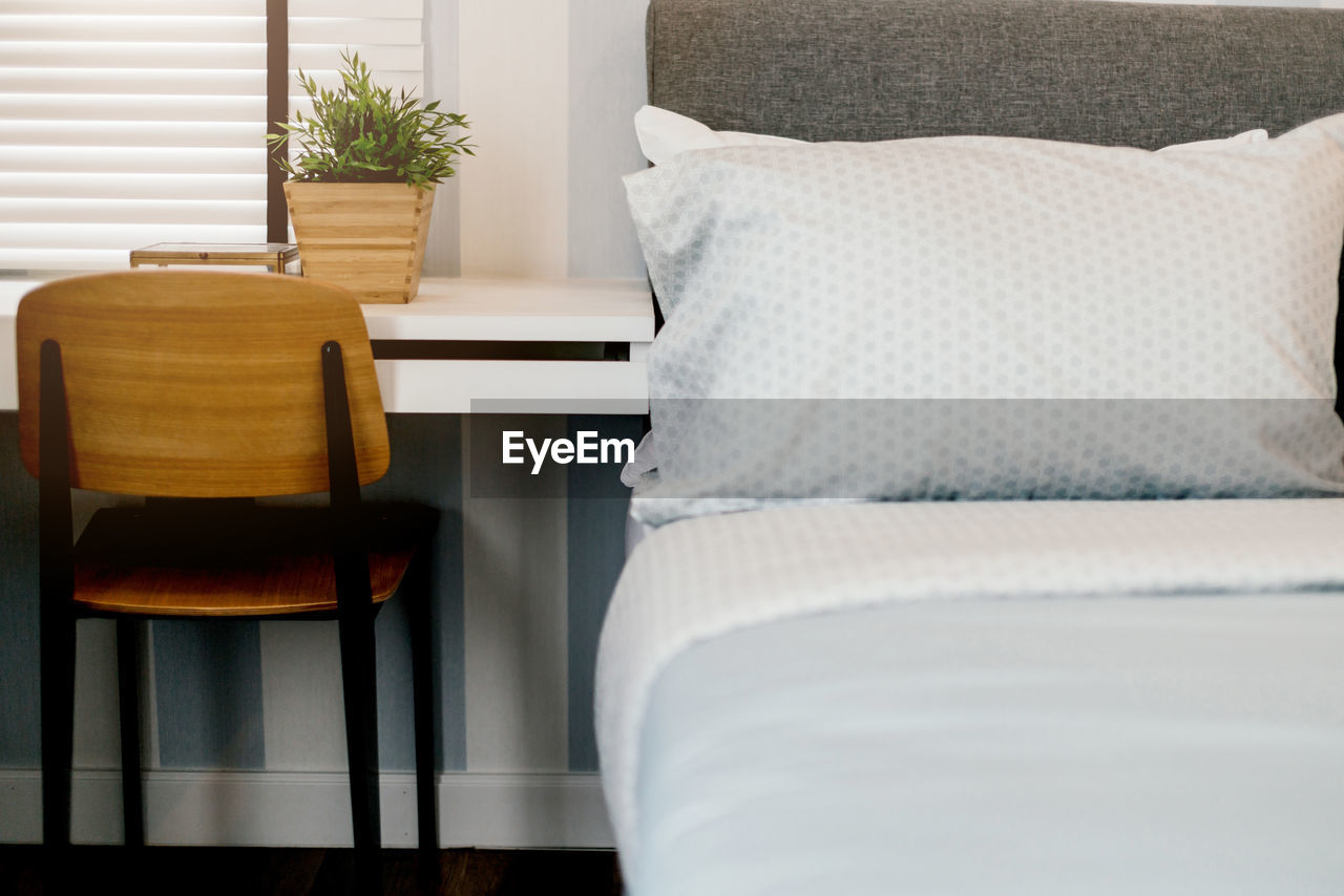 Close-up of pillows on bed