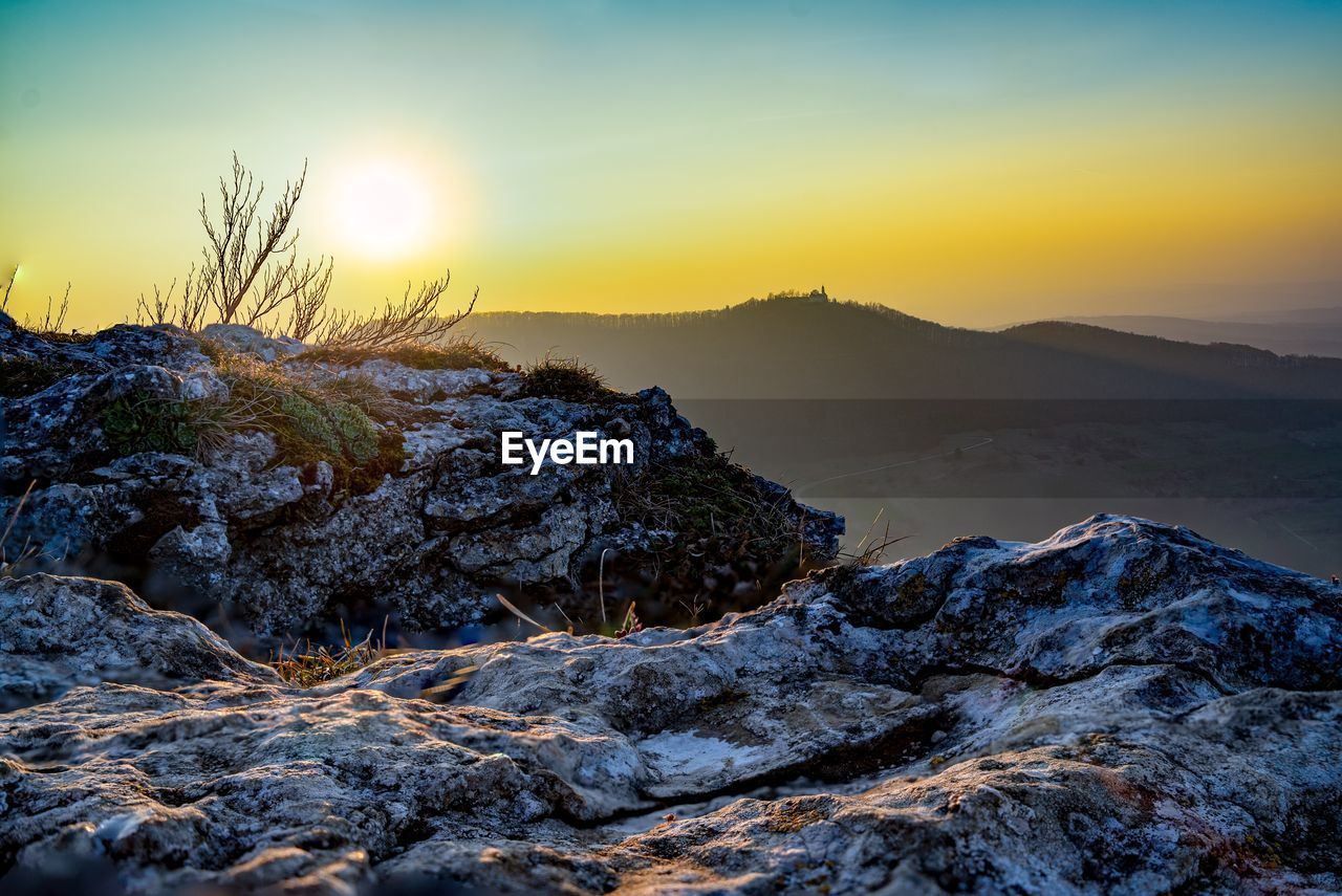 Scenic view of mountain against sky during sunset