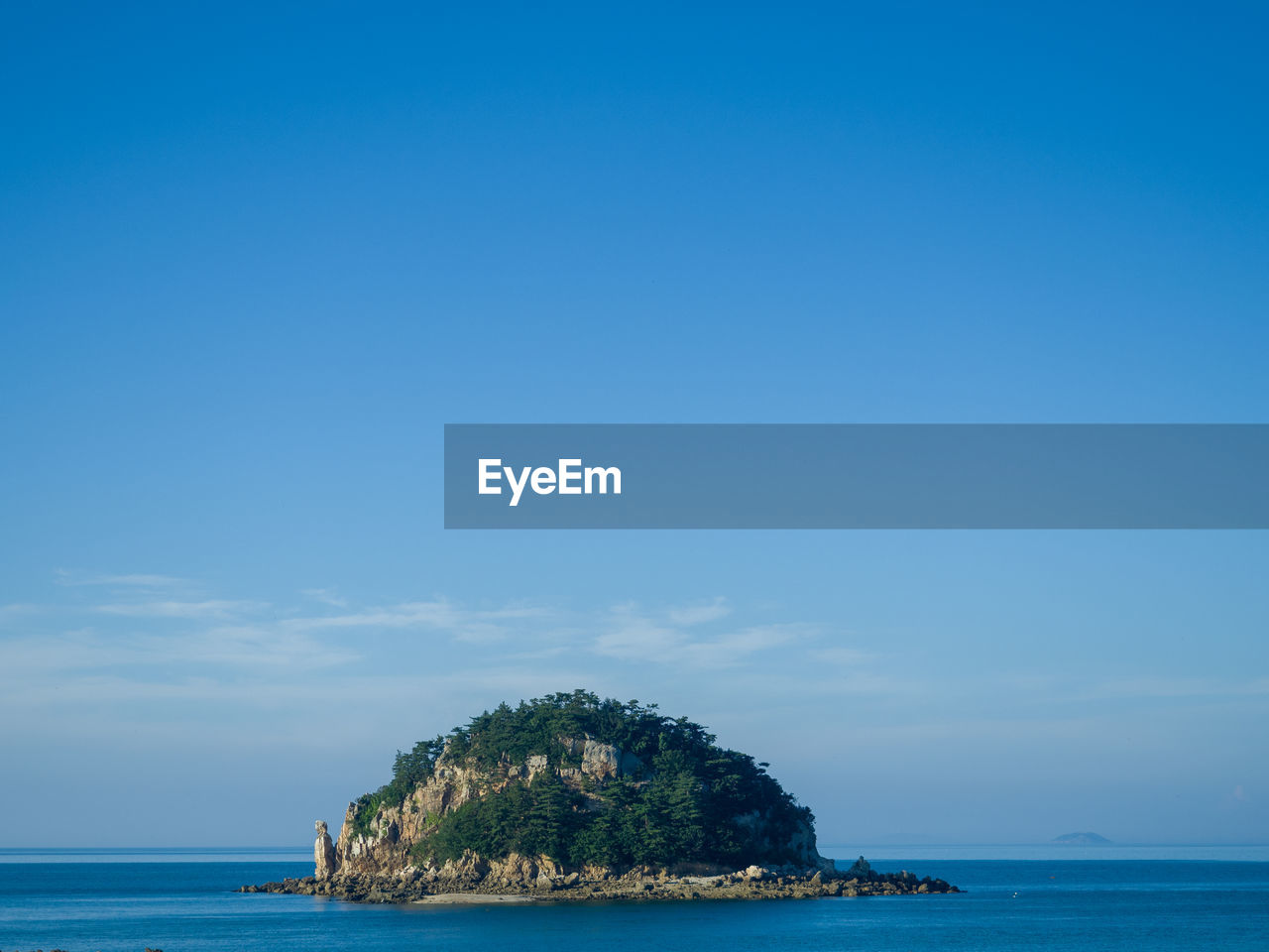 Scenic view of sea against blue sky