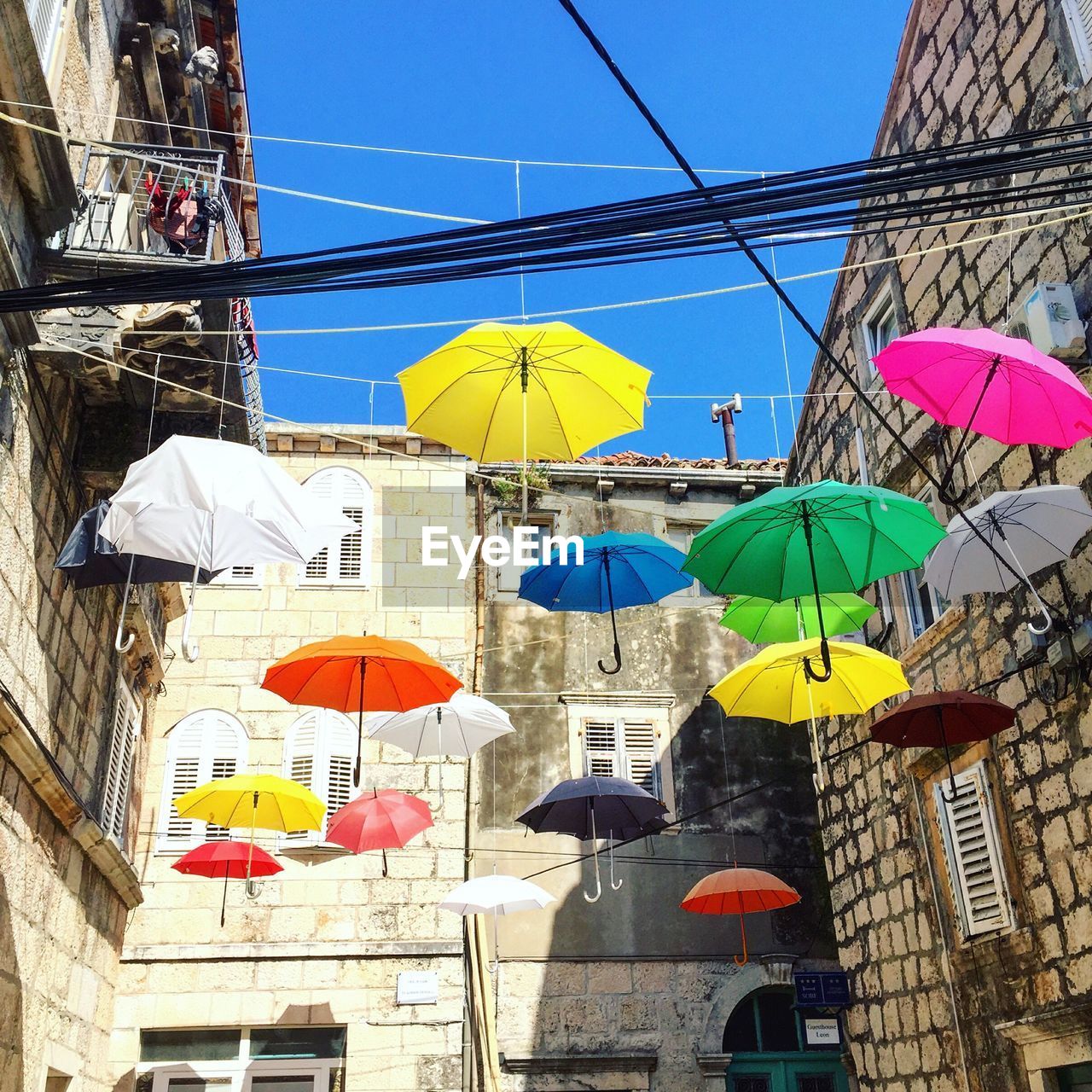 Multi colored umbrellas in city