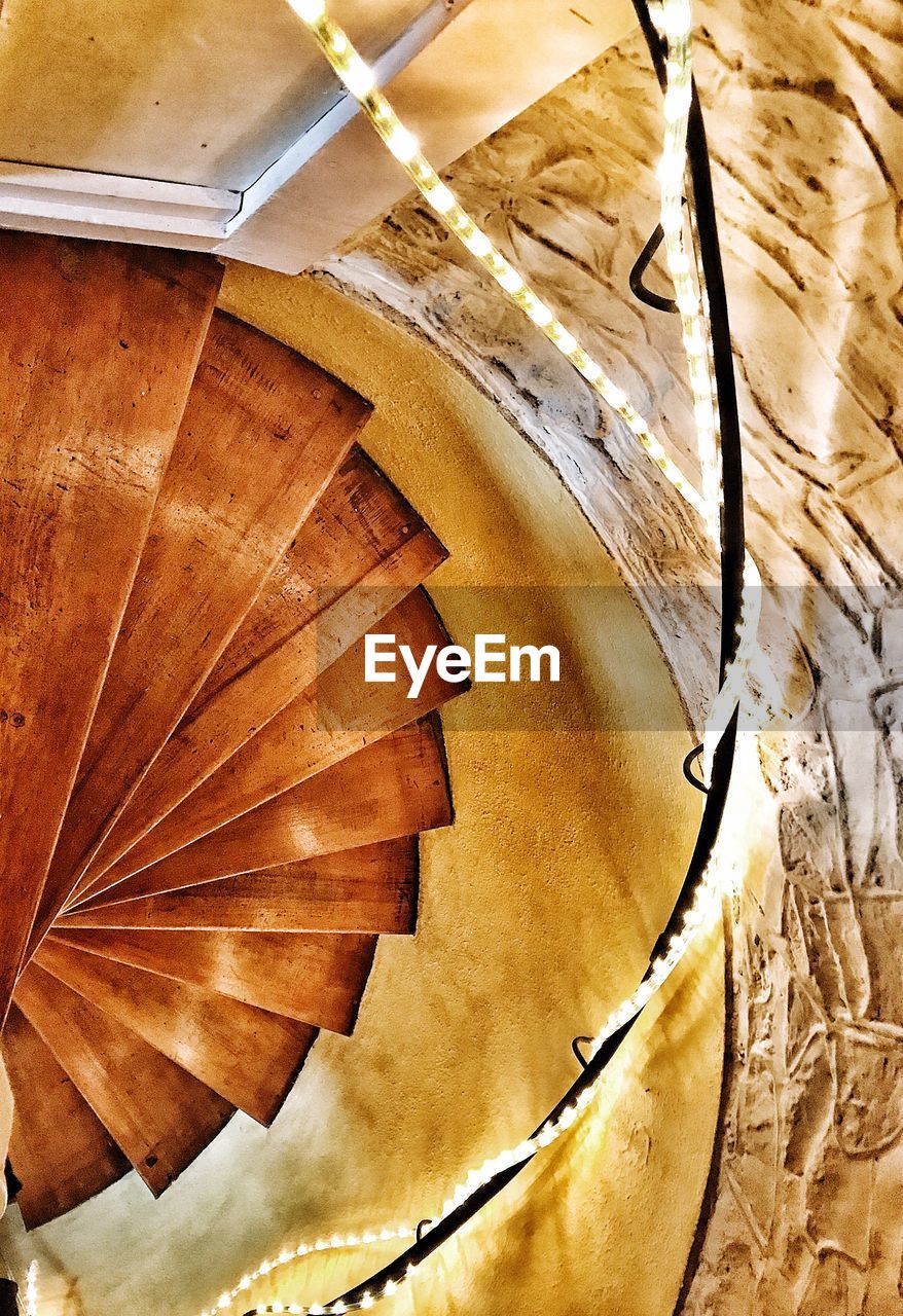 CLOSE-UP LOW ANGLE VIEW OF SPIRAL STAIRCASE