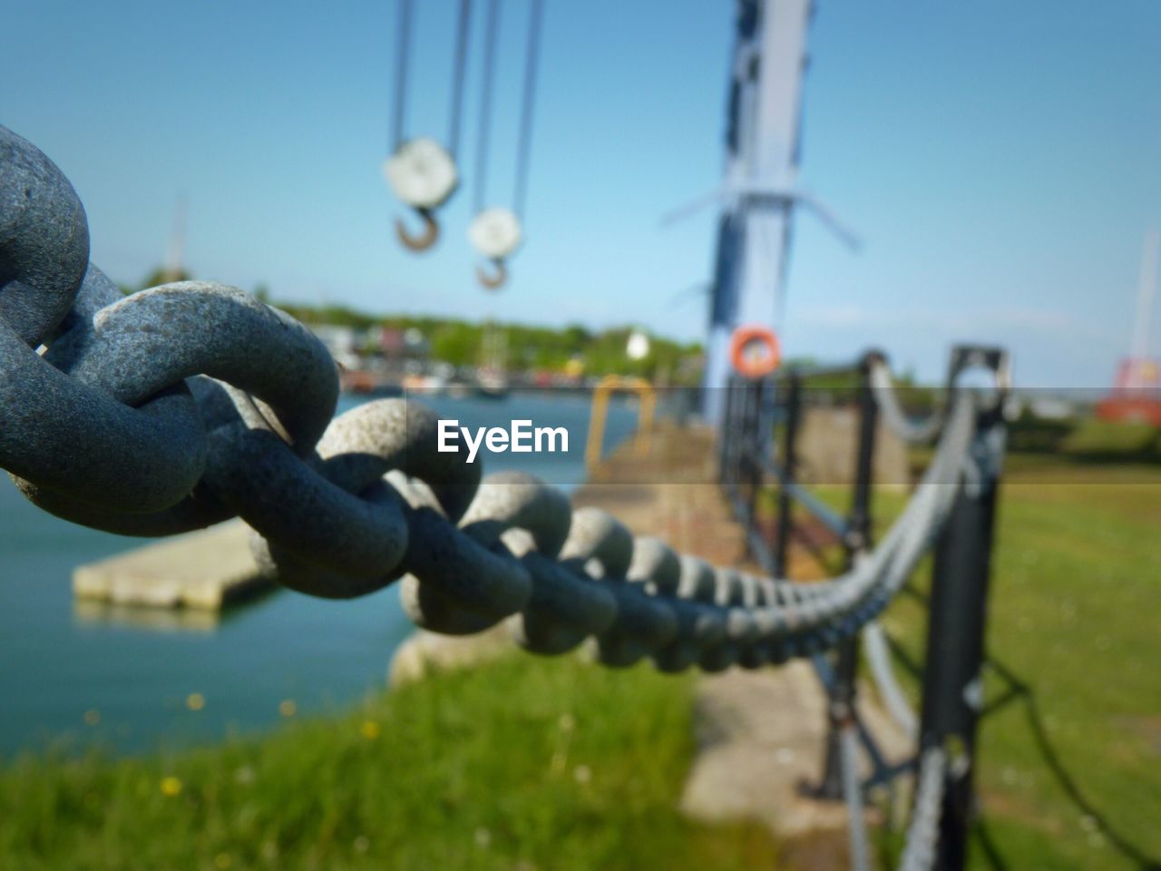 CLOSE-UP OF CHAIN LINK FENCE ON BRIDGE