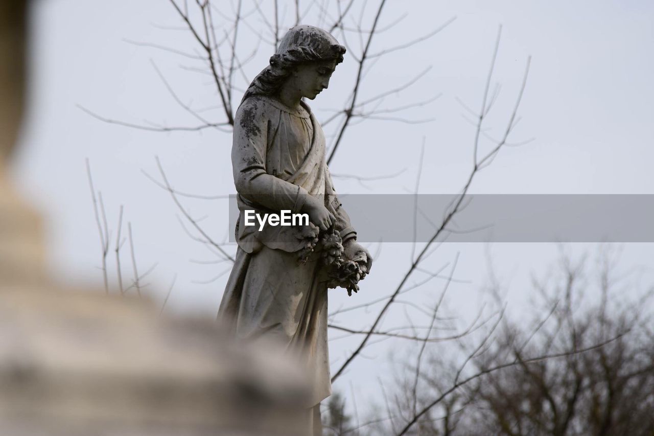 Female sculpture at cemetery