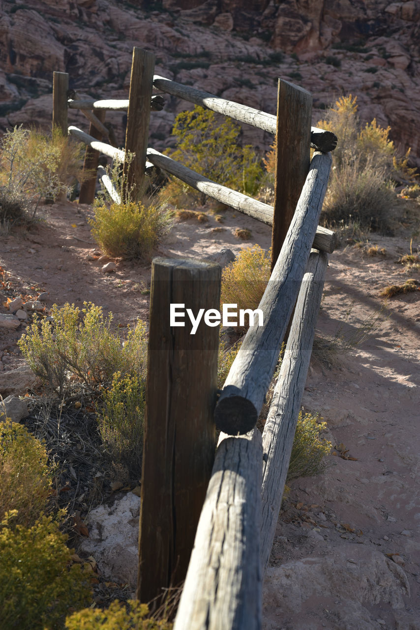 Close-up of wooden post of rail fence