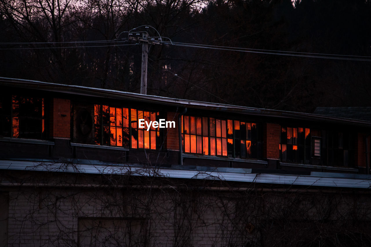 LOW ANGLE VIEW OF ILLUMINATED BUILDING