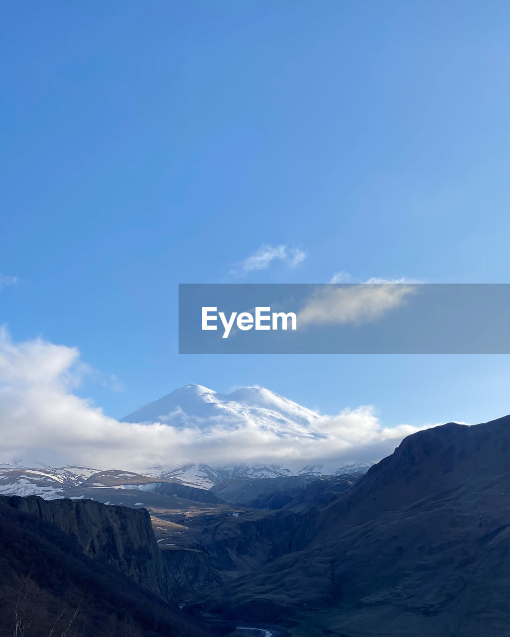 SCENIC VIEW OF MOUNTAINS AGAINST SKY DURING WINTER