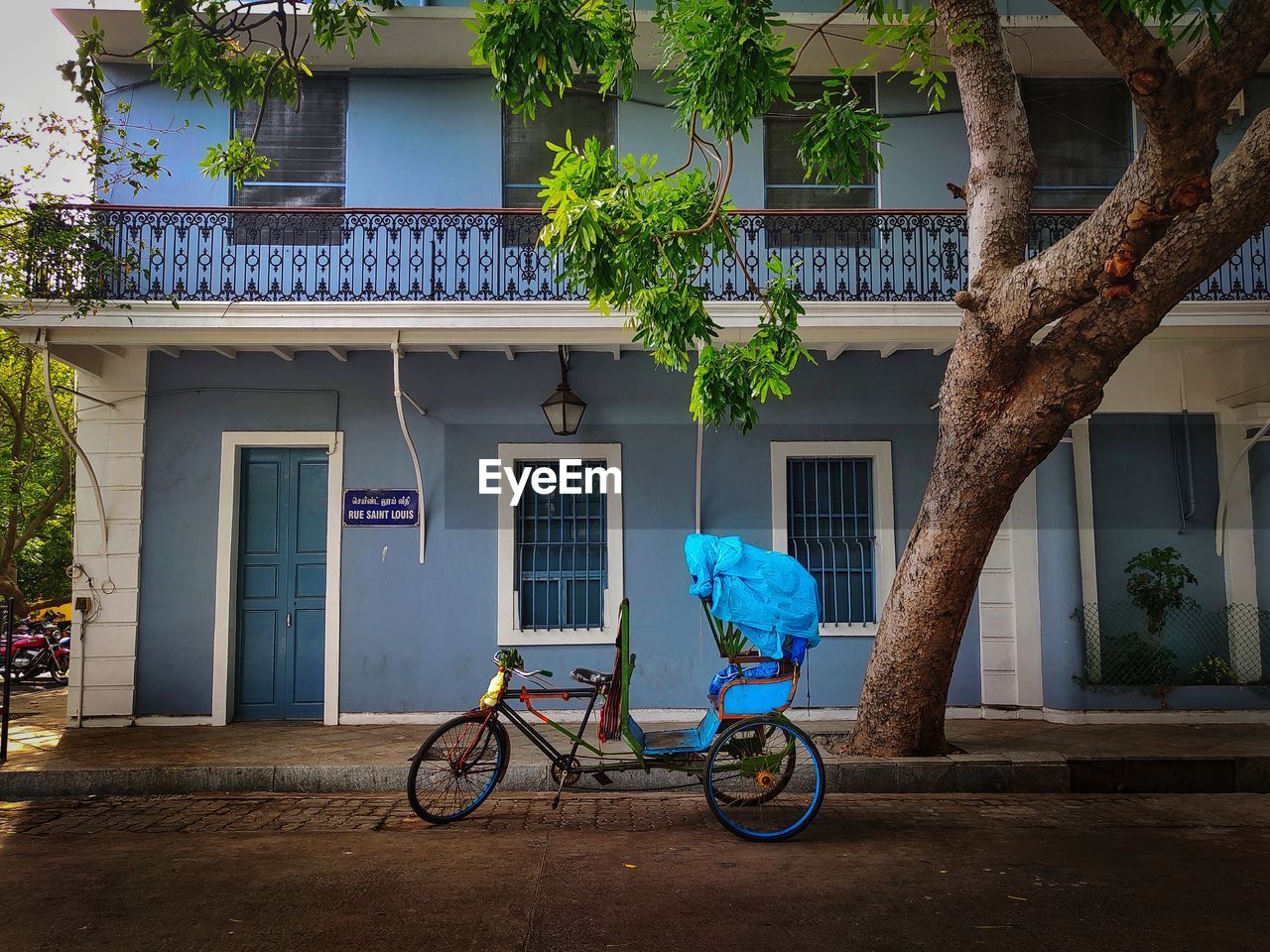 Bicycle on street against building