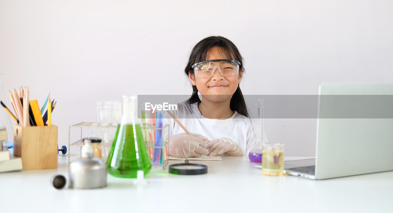 Girl experimenting at laboratory