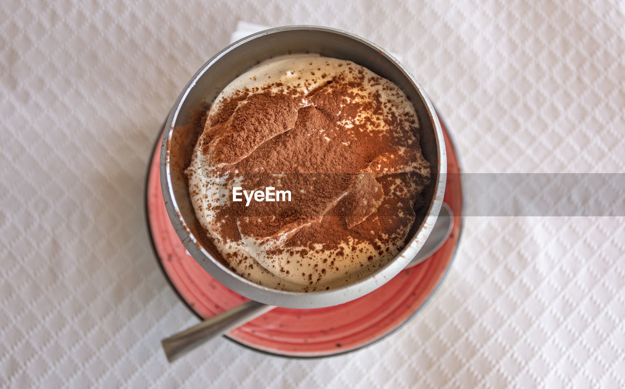 food and drink, food, dessert, indoors, high angle view, sweet food, freshness, no people, dish, chocolate, table, drink, kitchen utensil, sweet, directly above, eating utensil, still life, spoon, produce, chocolate cake, close-up, bowl, coffee, breakfast, mug, brown, refreshment