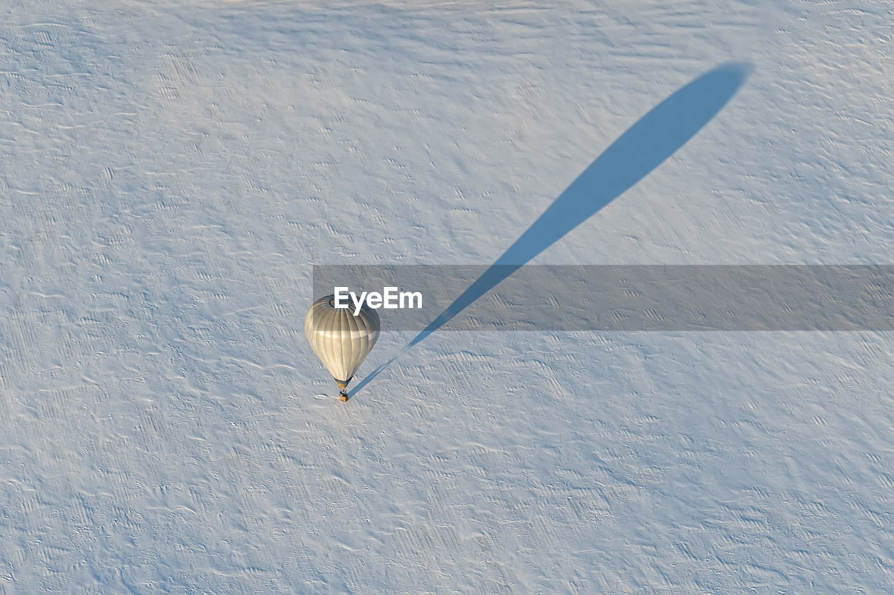 High angle view of hot air balloon on snow covered land