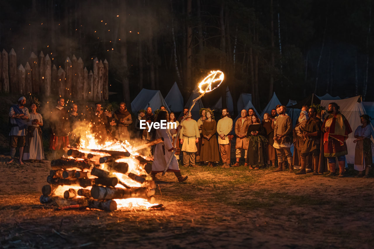 GROUP OF PEOPLE ON FIRE