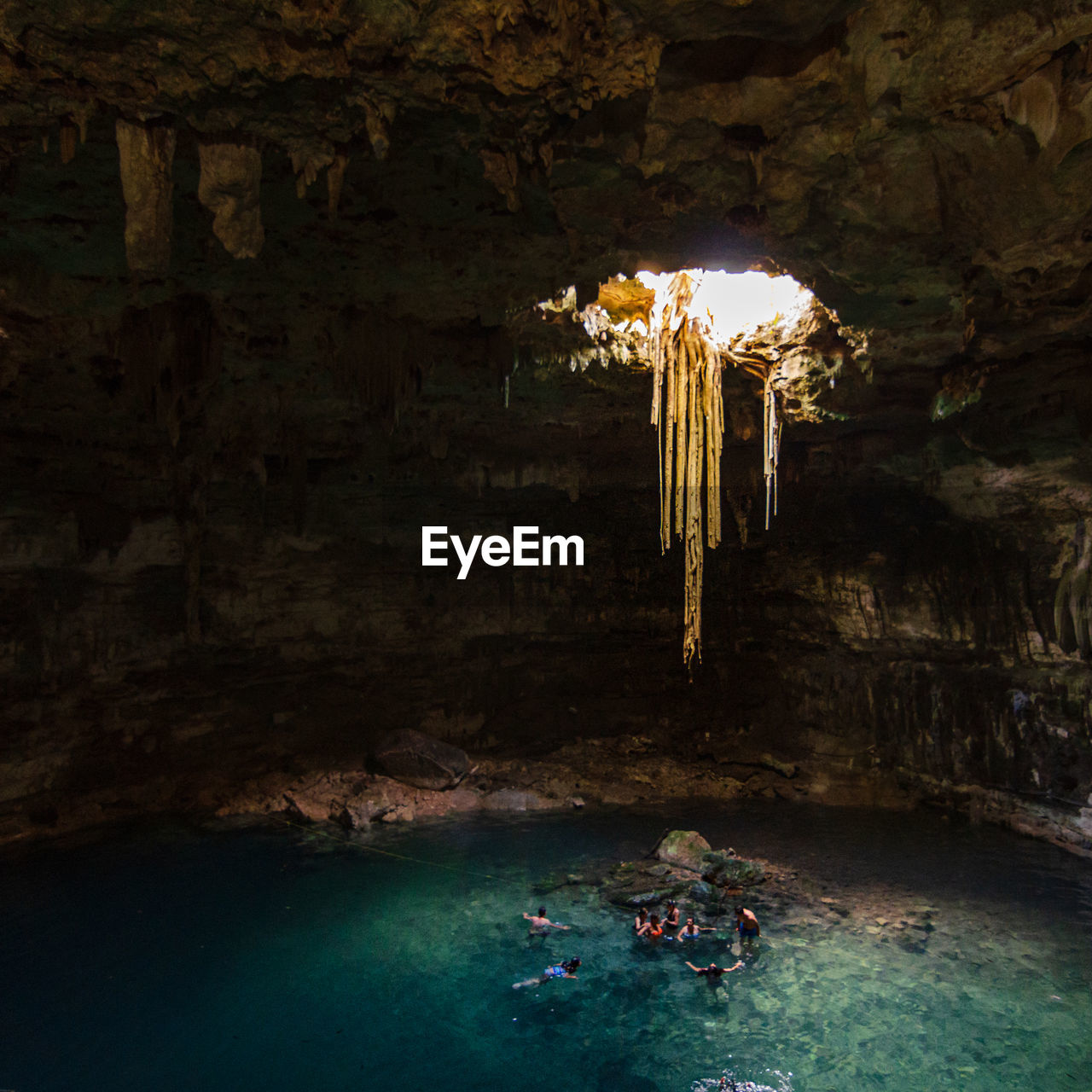 Scenic view of cenote through cave